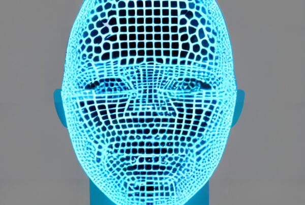 A blue mannequin head with a glowing digital wireframe pattern on a gray background.