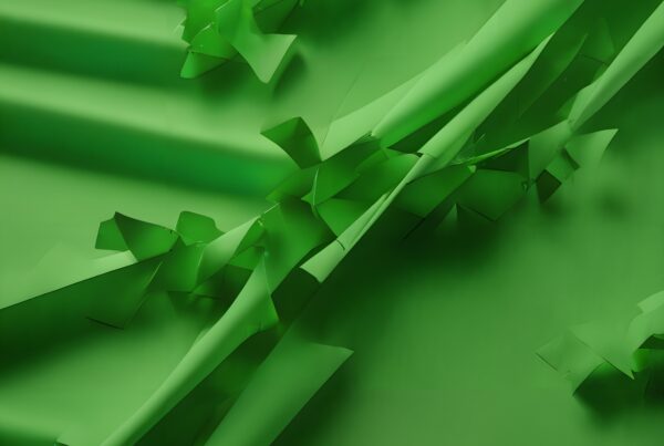 Abstract green paper folds creating dynamic movement.