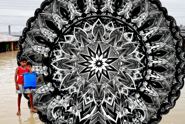 Children standing in floodwaters with a striking black and white mandala overlaid.