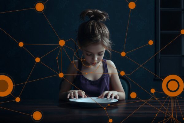 A young girl sits at a table with digital networks superimposed, reflecting connections.