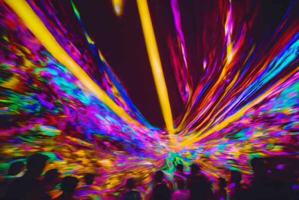 Explosion of Neon Lights at Dynamic Concert Event with Captivated Audience.