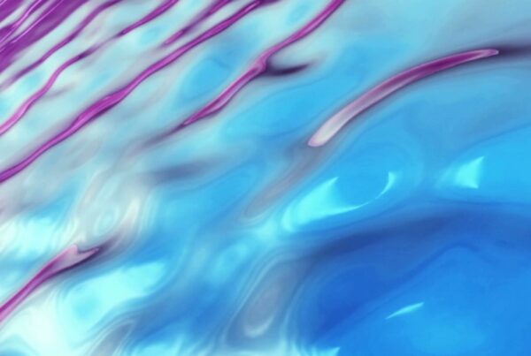 Abstract looping video featuring blue and magenta waves creating a fluid and dynamic pattern, conveying a sense of harmony and movement.