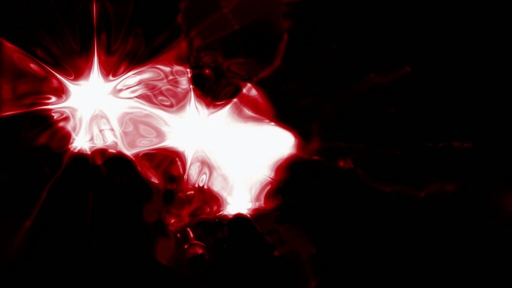 Abstract digital video loop featuring vibrant red and white star-like shapes emitting light against a dark background, creating a striking and dynamic visual experience.