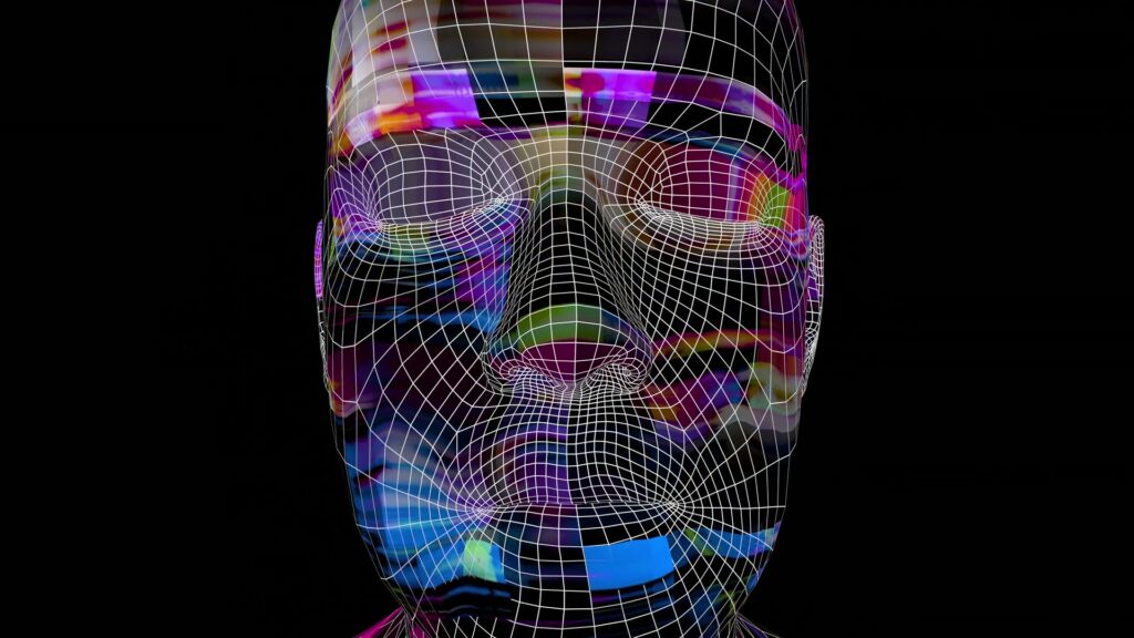 3D wireframe model of a human face overlaid with vibrant digital glitch patterns, illustrating a fusion of technology and art.