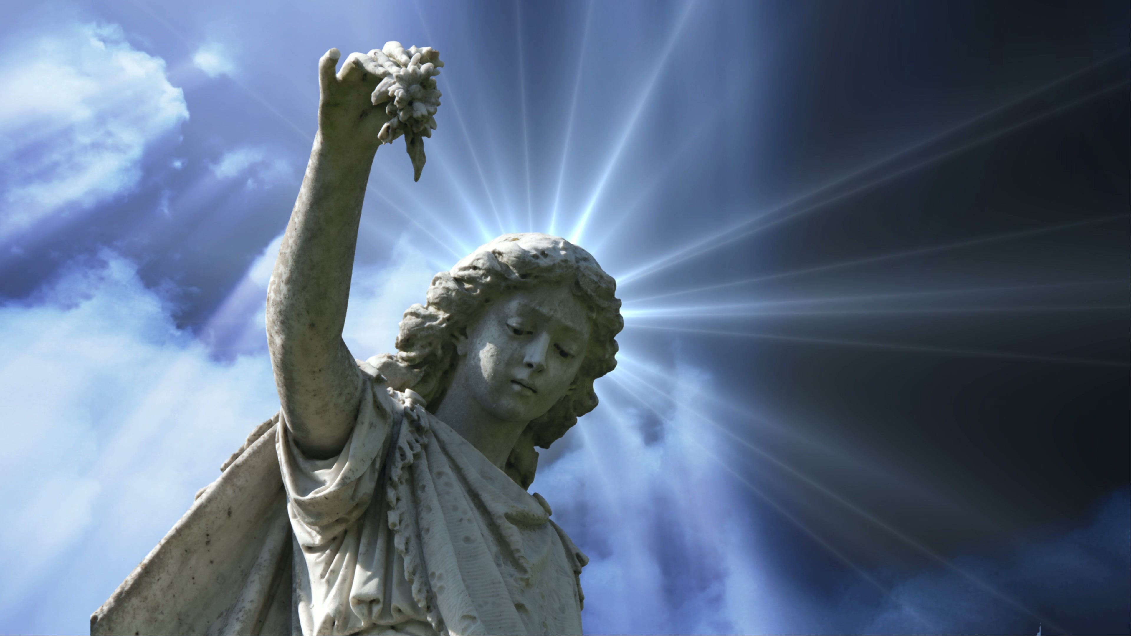 Angelic Statue with Radiant Light 4K Loop