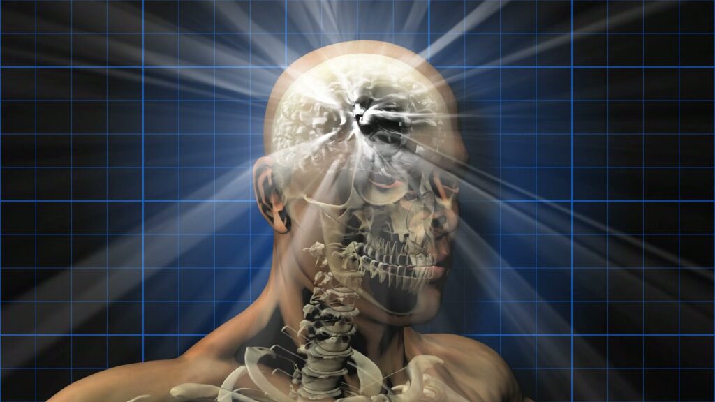 Video animation loop of a human head revealing internal anatomy with glowing brain beams against a grid background, symbolizing the fusion of technology and biological science.