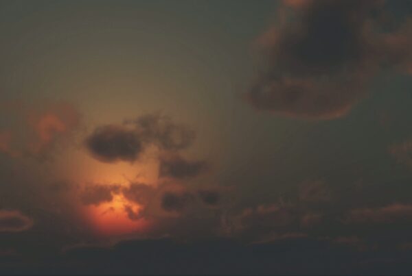 Beautiful sunset animation with dark clouds against an evening sky.