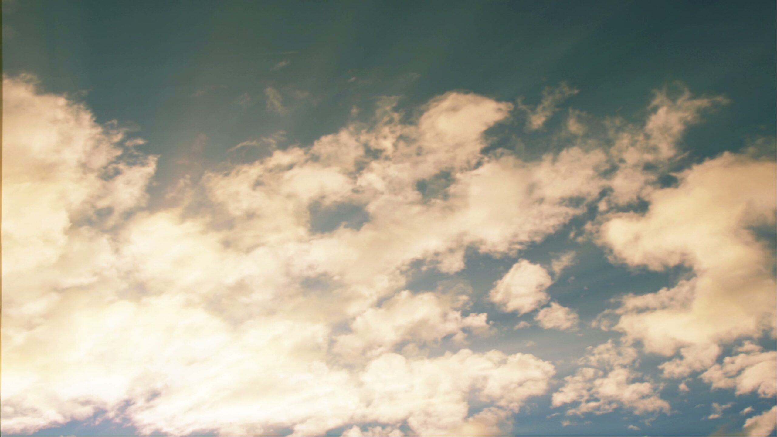 Golden Time-Lapse Clouds in Blue Sky 4K Video