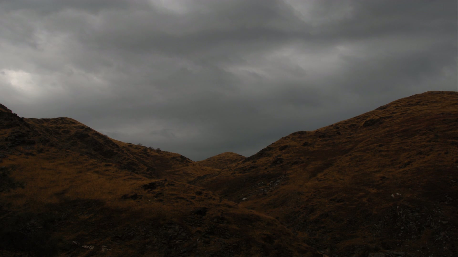 Dramatic Storm Clouds Over Mountains