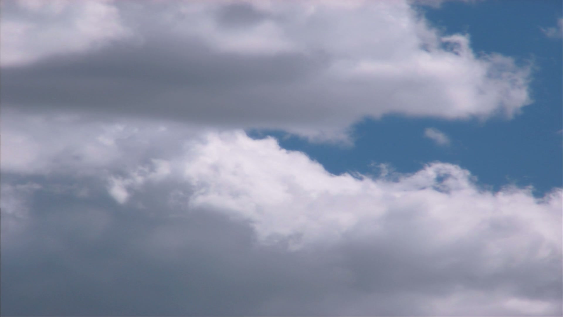 Dynamic Time-Lapse Clouds Against Blue Sky