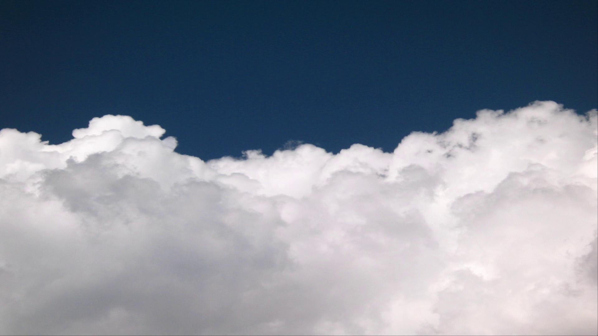 Timelapse Clouds Travel Through Blue Sky HD Video