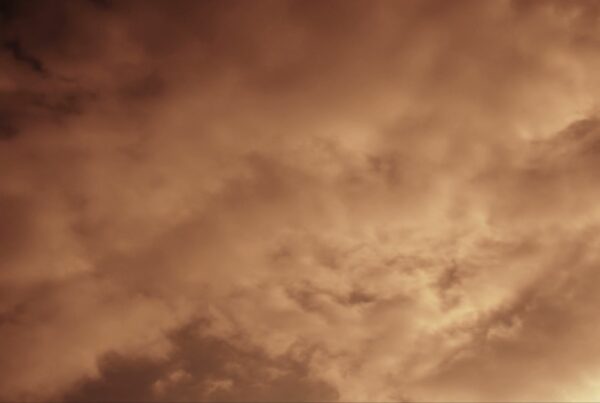 HD video of a dramatic time-lapse cloudy sky at sunset, showcasing swirling cloud formations and dynamic lighting.