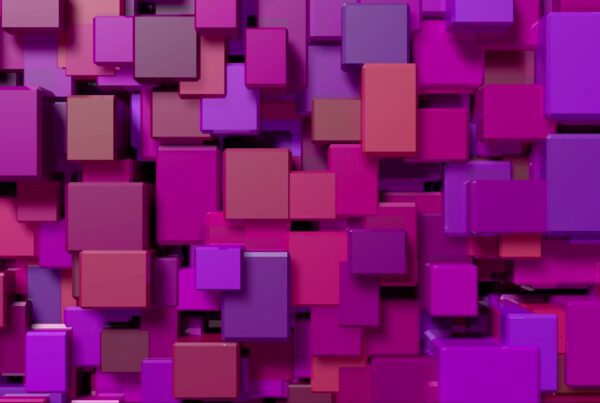 An abstract 3D animation loop featuring colorful cubes and rectangles in shades of purple, pink, and red, layered to create a vibrant and dynamic geometric pattern.