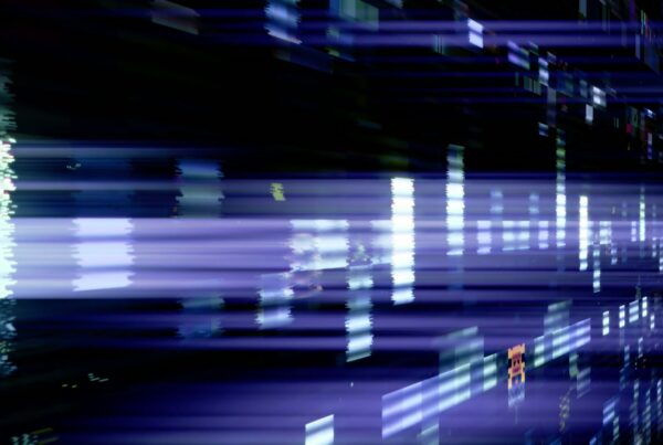 This video is an abstract loop featuring horizontal streaks of digital glitch light in shades of blue and purple.