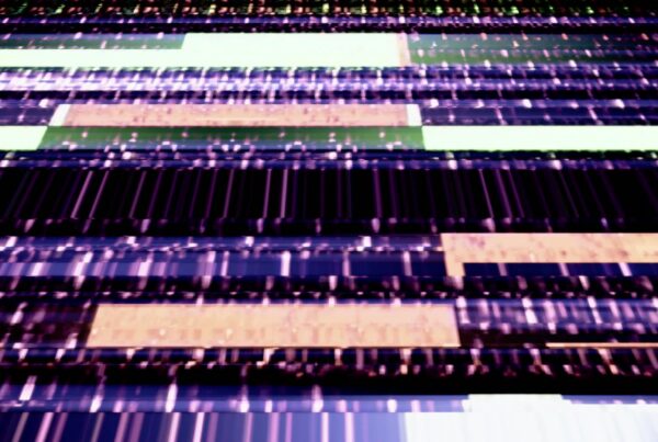 Abstract video loop with vibrant, glitchy digital stripes in purple, green, and beige, creating a dynamic and modern aesthetic.