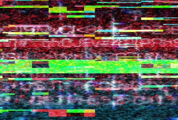 A vibrant digital video loop glitch featuring chaotic horizontal lines in red, green, and blue, evoking a sense of technological malfunction and abstract art.