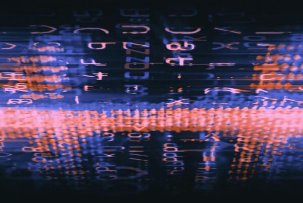 Abstract digital art video loop with neon blue and orange alphanumeric glitches.