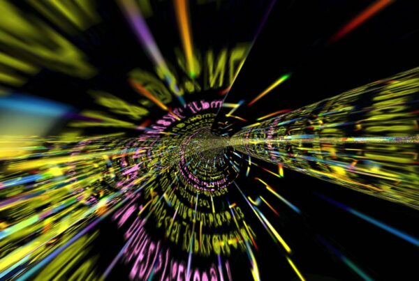 A colorful video loop of a streaming digital tunnel with swirling text, creating a futuristic and dynamic visual effect in bright neon colors against a dark background.