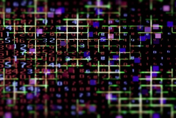 The video loop showcases a digital matrix grid filled with animating numbers and code in multiple colors.