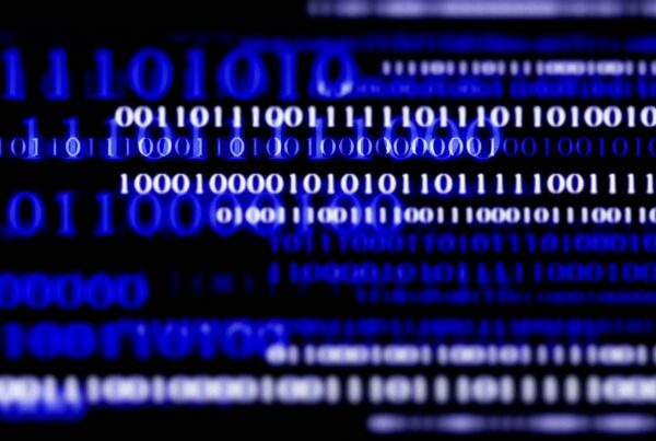 Abstract video loop depicting lines of scrolling blue and white binary code, representing digital technology and data processing.