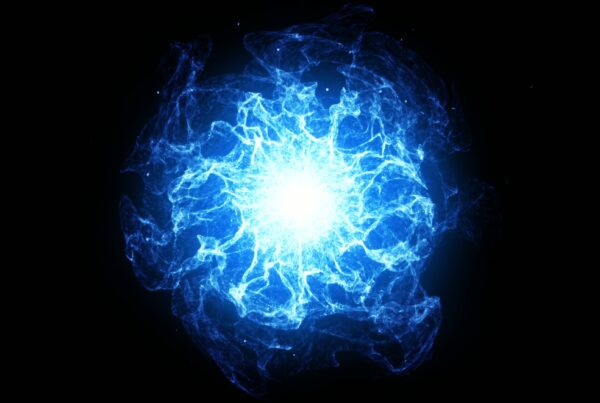 Video loop of an electric blue energy burst on dark background, with radiant tendrils and dynamic light patterns creating a cosmic effect.
