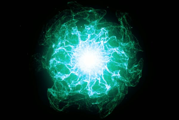 Glowing abstract 4K video loop cosmic energy burst with vibrant blue and turquoise light against a black background.