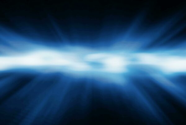 Abstract 4K video loop of blue and white energy waves on a dark background, creating a dynamic and calming visual effect.
