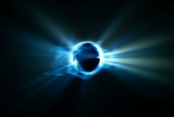 Abstract 4K video loop of a glowing blue sphere emitting radiant energy against a dark background.