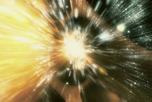 A 4K video loop of a dynamic cosmic explosion with radiant light streaks and star-like specks in a vast universe setting.