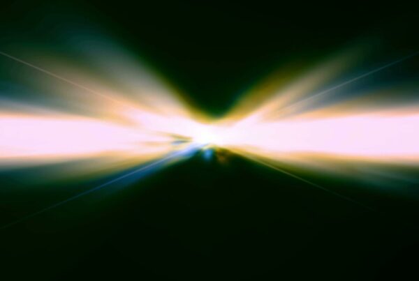 A dramatic video loop burst of radiant light against a dark background, with colorful gradients adding depth and energy.