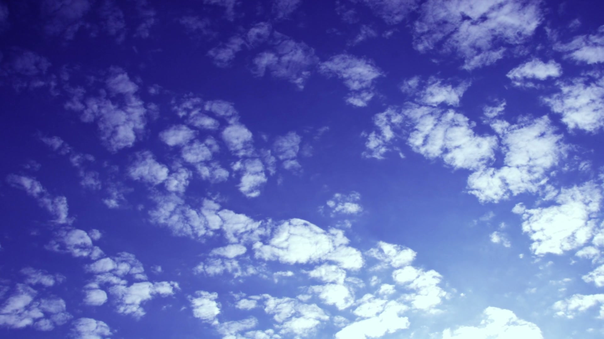 Serenely Scattered Time-Lapse Clouds Above