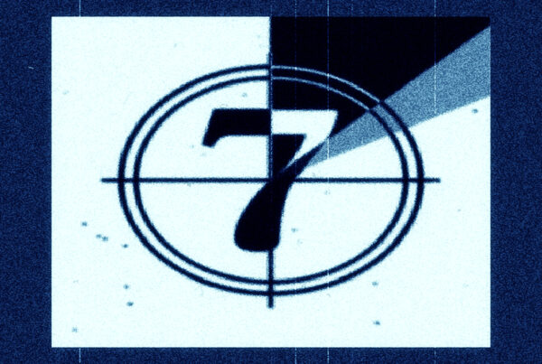 A classic animated film countdown with the numbers displayed at its center.