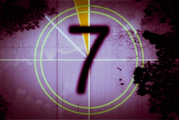 Vintage film countdown displaying numbers with a grungy purple background.