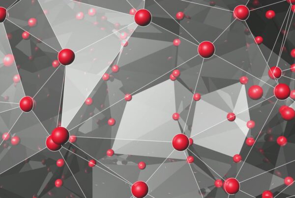 Digital abstract video loop featuring interconnected red spheres on a geometric background, illustrating network connectivity and modern design principles.