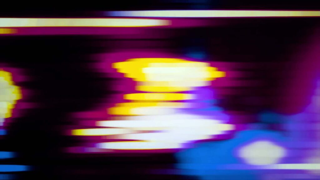 Abstract video loop showcasing a vibrant blend of pulsing blue, purple, and yellow colors, illustrating dynamic motion and energy.
