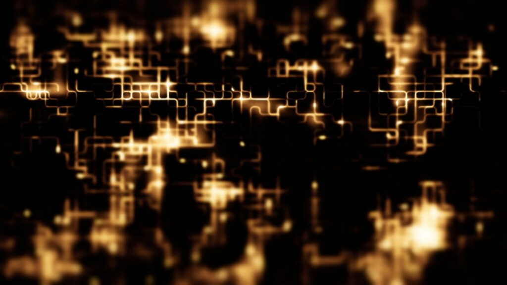 Abstract animation loop featuring a glowing network of golden lines forming a complex grid pattern against a dark background, resembling a futuristic cityscape or circuit board.