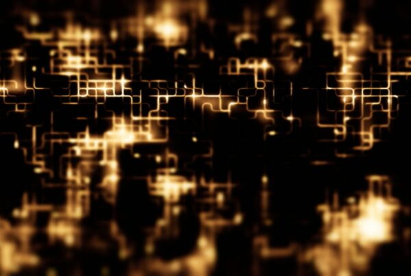 Abstract animation loop featuring a glowing network of golden lines forming a complex grid pattern against a dark background, resembling a futuristic cityscape or circuit board.