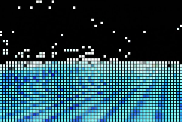 An abstract looping video featuring an animated pixelated mosaic pattern with shades of blue, white, and green squares, creating a striking contrast within a structured grid design.