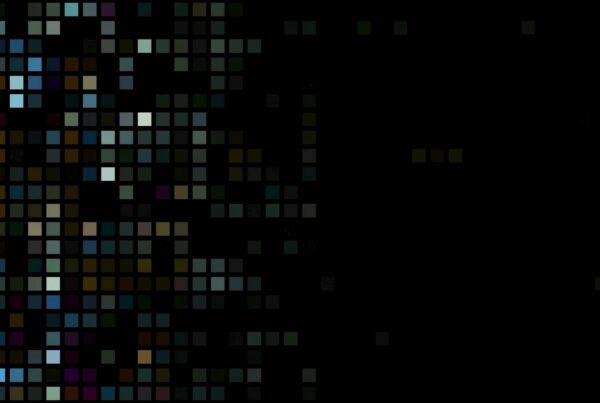 Abstract video loop of multicolored squares on a black background forming a dynamic mosaic pattern.