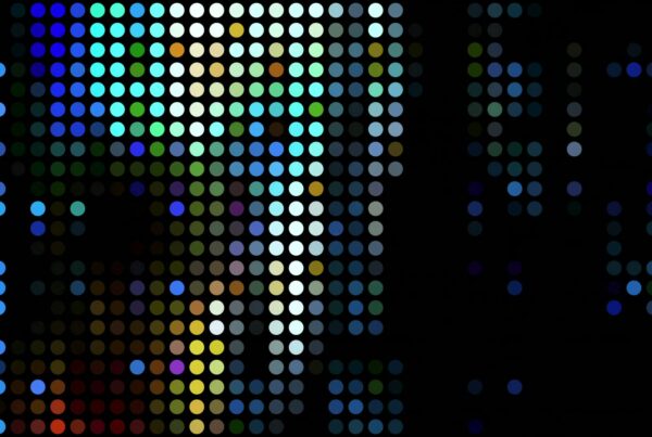 Abstract HD video loop featuring a grid of colorful dots against a black background, creating a vibrant and dynamic pattern reminiscent of digital art or pointillism.