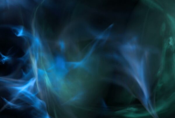 Abstract swirling video loop with blue and green hues creating a dynamic and ethereal scene, evoking a sense of depth and tranquility.