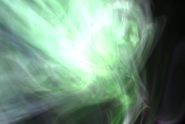 An abstract animation of swirling green gaseous light dominate the video loop.