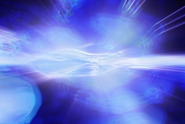 Abstract 4K video loop of blue energy waves and light streaks creating a glowing effect with fluid motion.