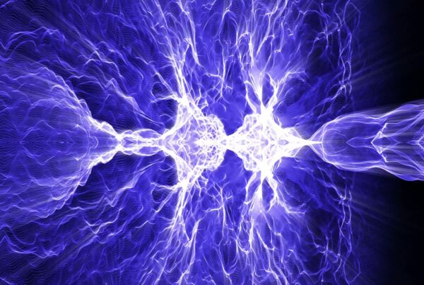 Abstract looping video of electric blue plasma patterns with luminous tendrils emanating from a central point, set against a dark video background.