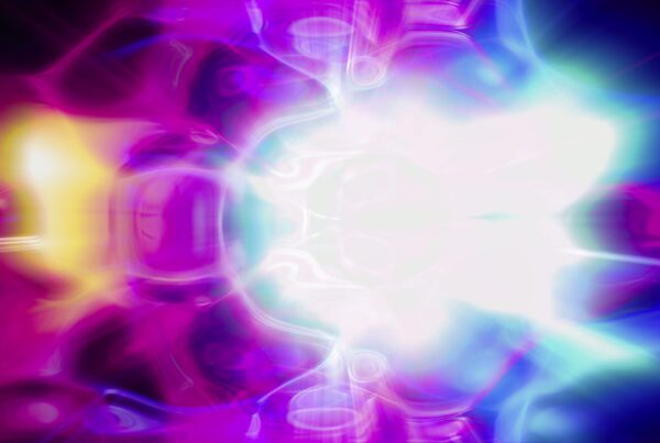 A vivid abstract 4K video loop with swirling neon colors and bright central light.