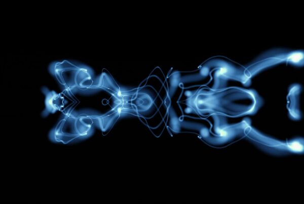 Abstract video loop with glowing blue symmetrical patterns against a black background, creating a luminous and futuristic visual effect.