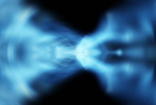 Abstract video loop featuring a mystical blue energy vortex with ethereal patterns on a dark background, creating a sense of depth and cosmic energy.