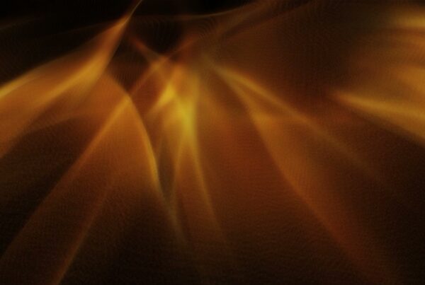 Abstract art video loop featuring swirling gold light patterns with warm tones, creating a dynamic and luminous appearance.