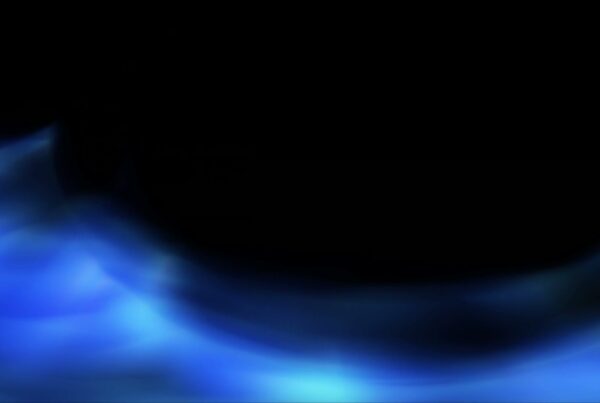 Abstract looping video of blue wavy patterns against a black background, resembling cosmic waves or nebulae with a sense of depth and flowing motion.
