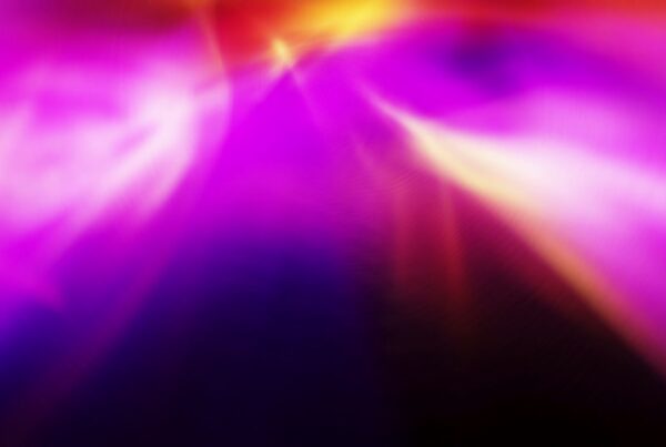 Abstract video loop animation with vibrant colors blending seamlessly, featuring dominant purples, pinks, and yellows, creating a dynamic and ethereal atmosphere.